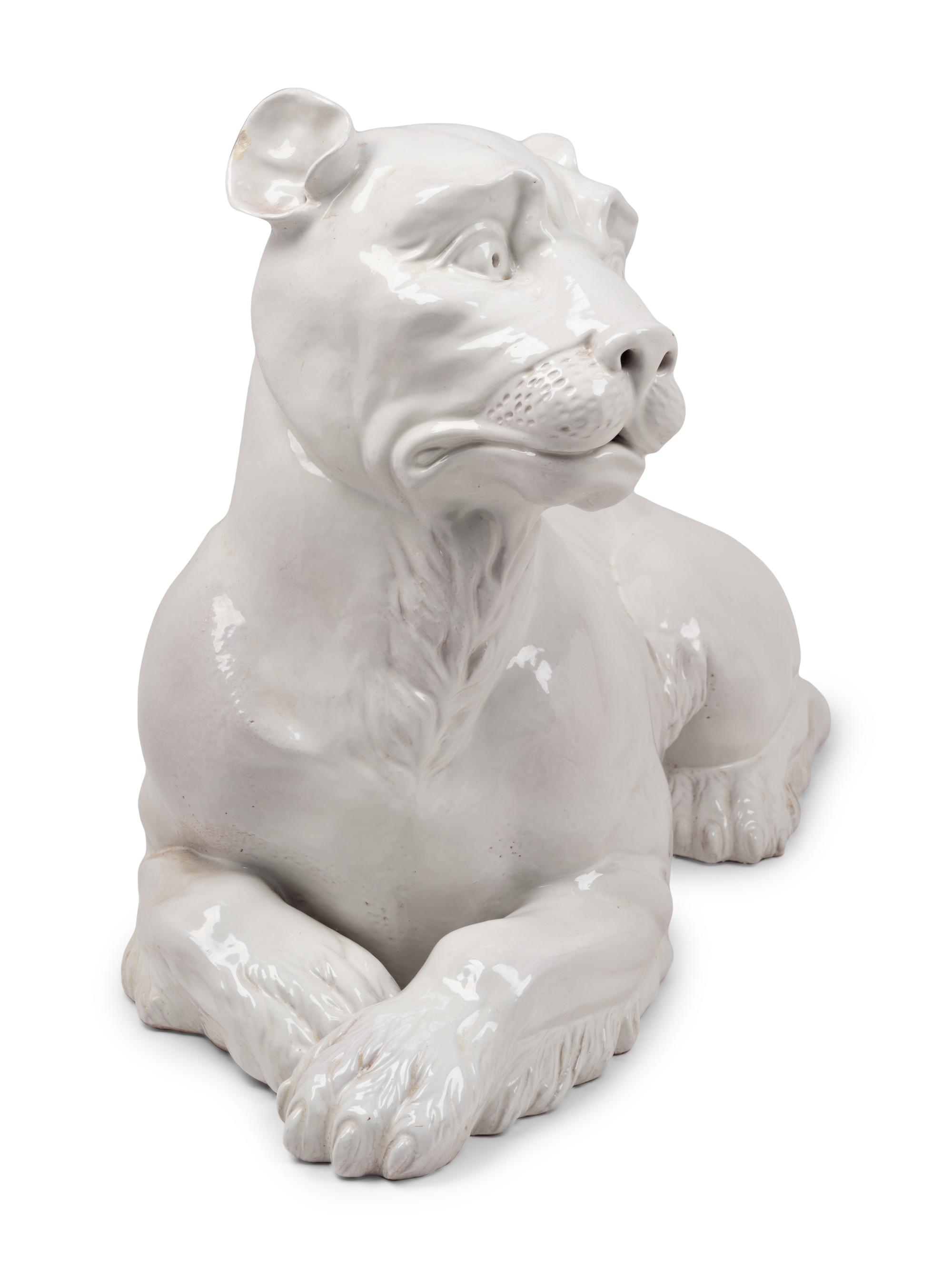 An Italian Painted Terra Cotta Figure of a Recumbent Dog