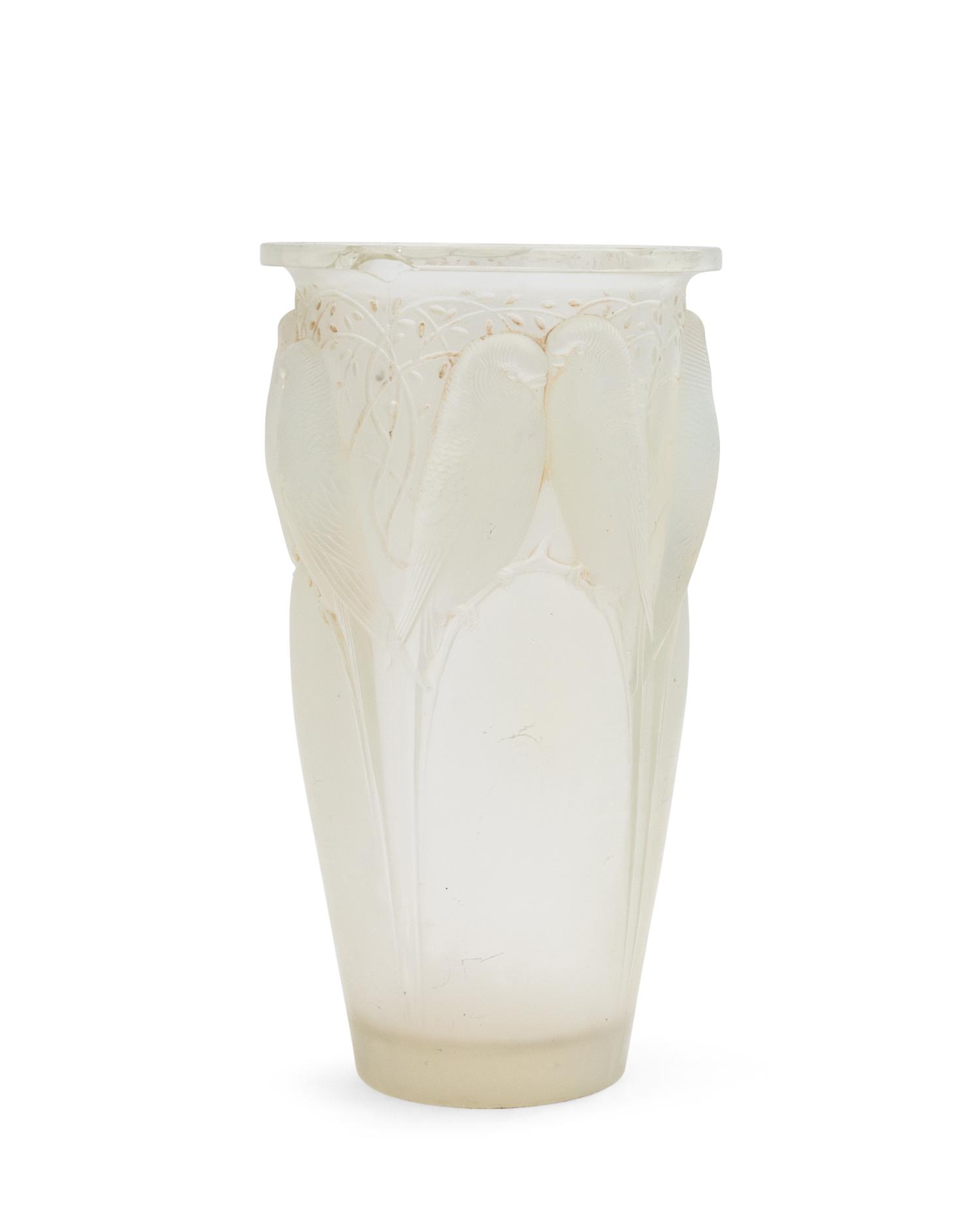 A Rene Lalique Molded and Opalescent Glass Vase Height 9 1/4 inches.