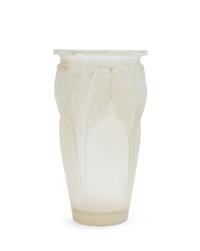 A Rene Lalique Molded and Opalescent Glass Vase Height 9 1/4 inches.