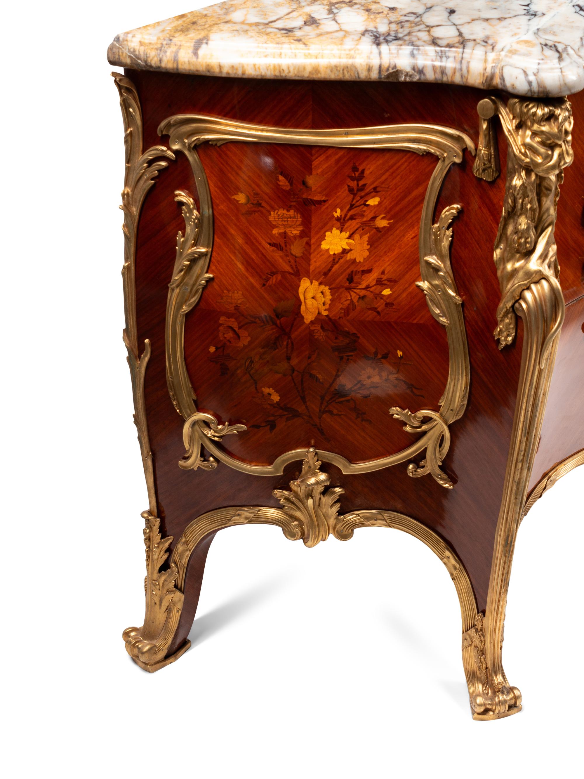 A Pair of Louis XV Style Gilt Bronze Mounted Kingwood and Floral Marquetry Marble-Top Commodes