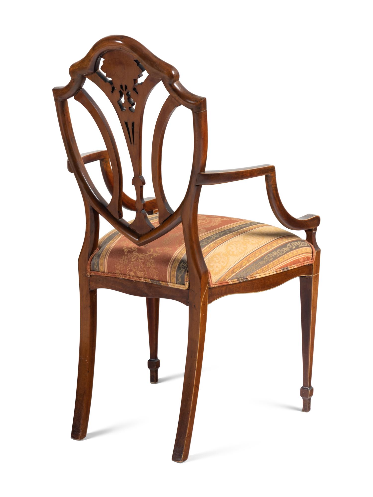 An Edwardian Painted Satinwood Triple-Back Settee and Armchair