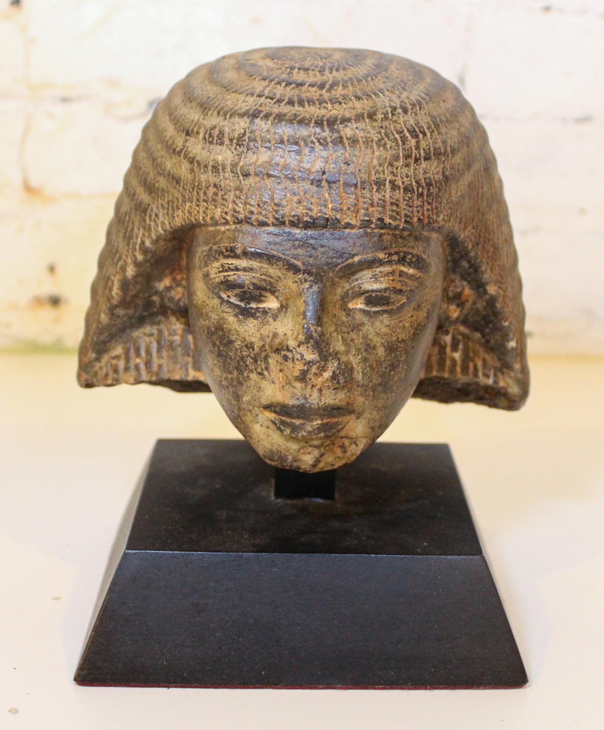 An Egyptian Style Cast Stone Bust. Height 6 1/2 inches.
