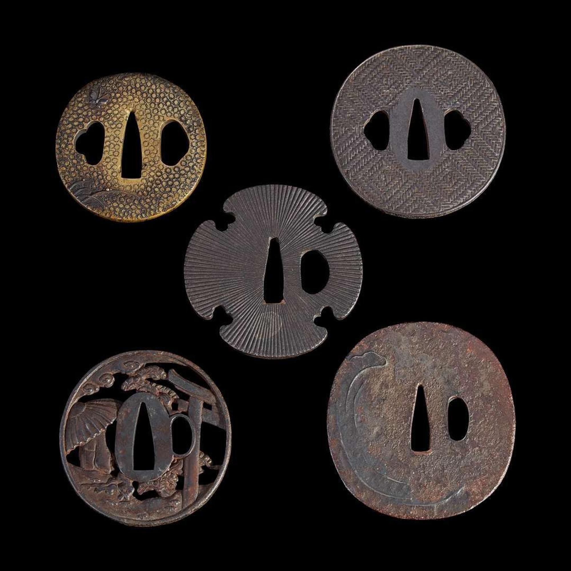 Group of nine Japanese tsuba Meiji period and earlier