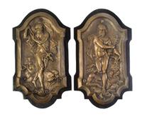 A Pair of Continental Cast Metal Relief Plaques, Height 13 1/2 x width 7 1/2 inches.