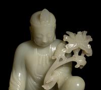 A Pale Celadon Jade Figure of Guanyin