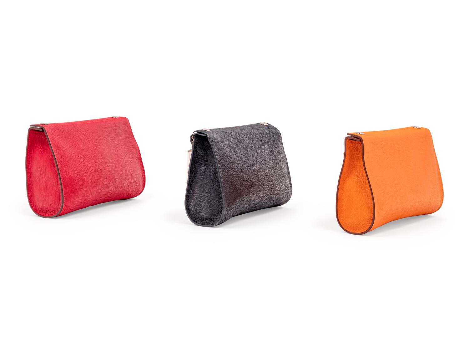 Three Hermès Leather Karo Trousse Cosmetic Bags, 2000-2013