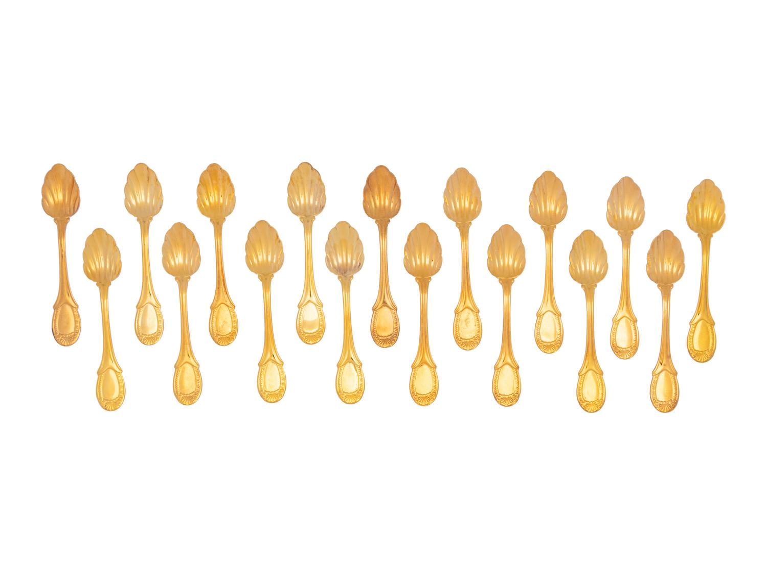 A Set of Twenty-One Gilt Metal Dessert Spoons