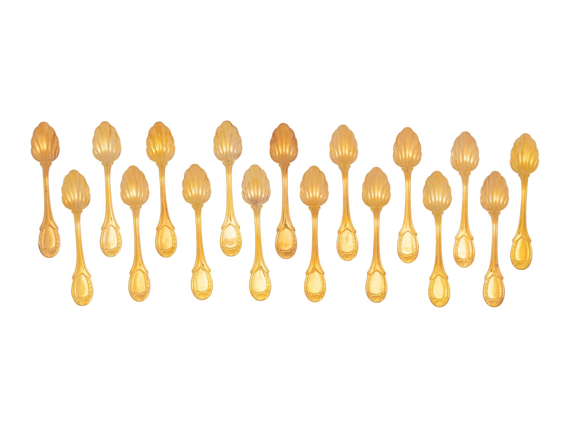 A Set of Twenty-One Gilt Metal Dessert Spoons