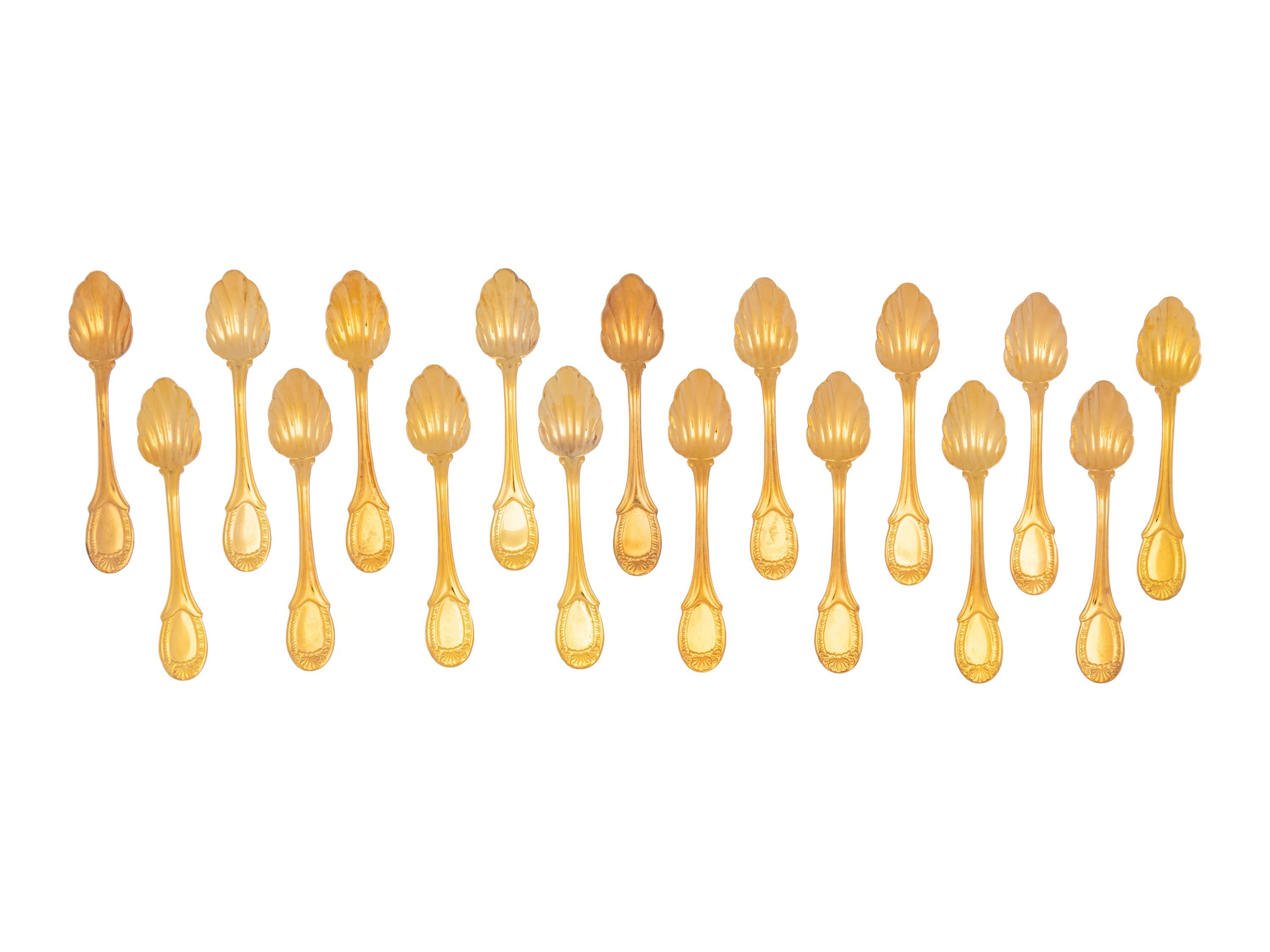 A Set of Twenty-One Gilt Metal Dessert Spoons