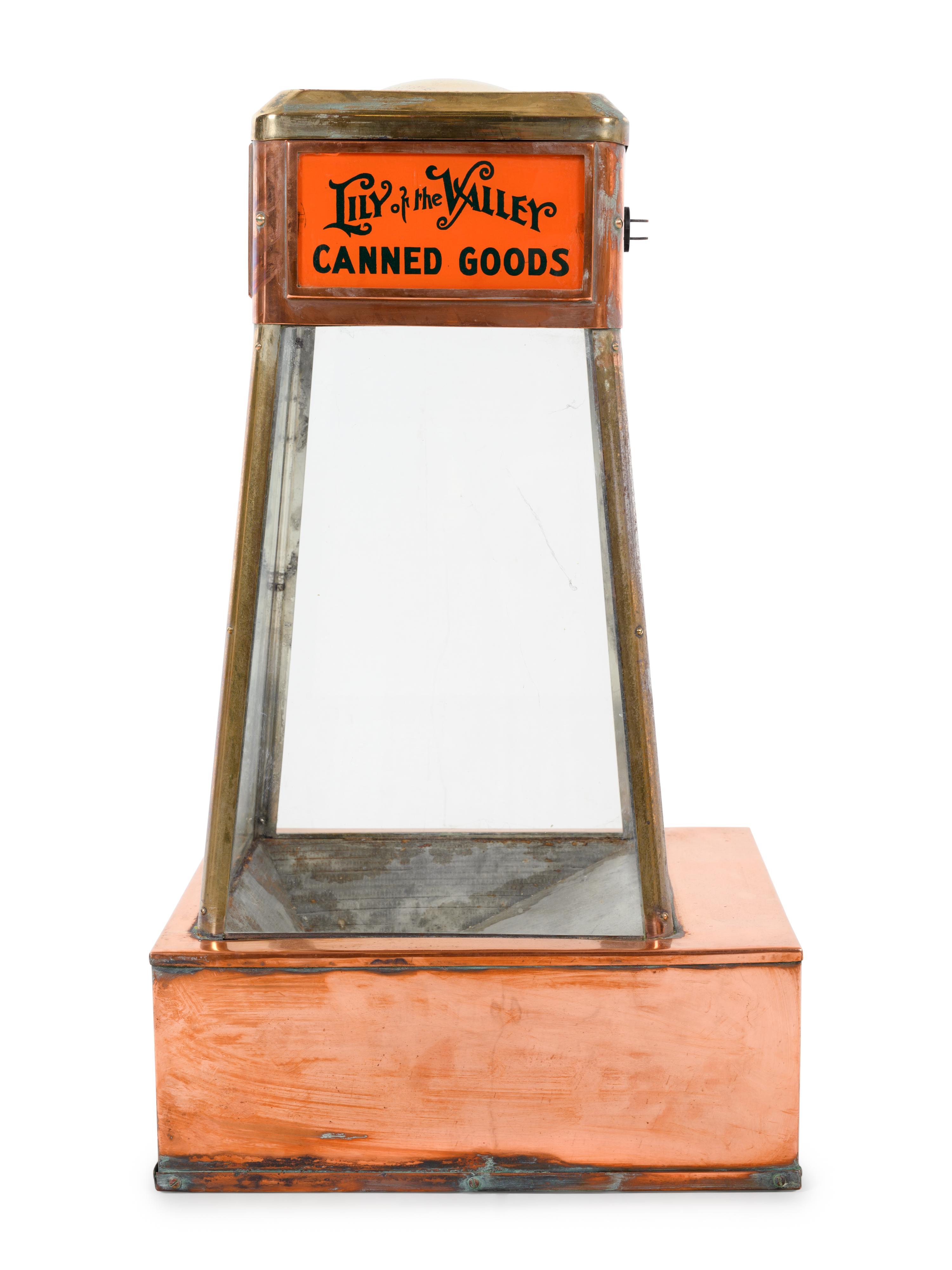 A Dwinell-Wright Co. Coffee Advertising Box, along with a Copper and Brass Colonial Coffee and Lily of the Valley Canned Goods Counter Top Vitrine Display Case