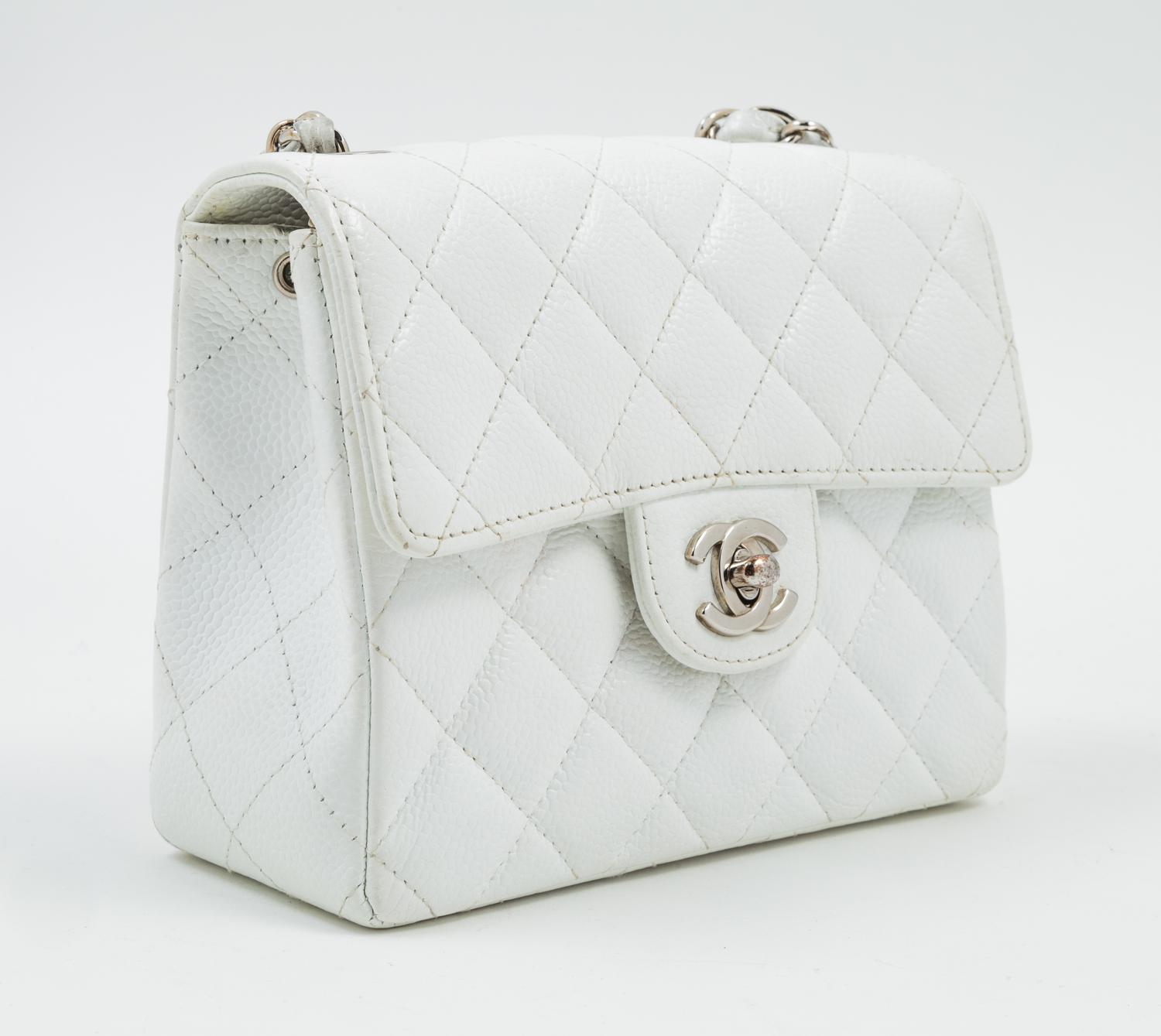 A Chanel White Caviar Mini Cross Body Flap Bag, 6.5" x 5.5" x 2.5"; Strap drop: 21"