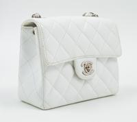 A Chanel White Caviar Mini Cross Body Flap Bag, 6.5" x 5.5" x 2.5"; Strap drop: 21"
