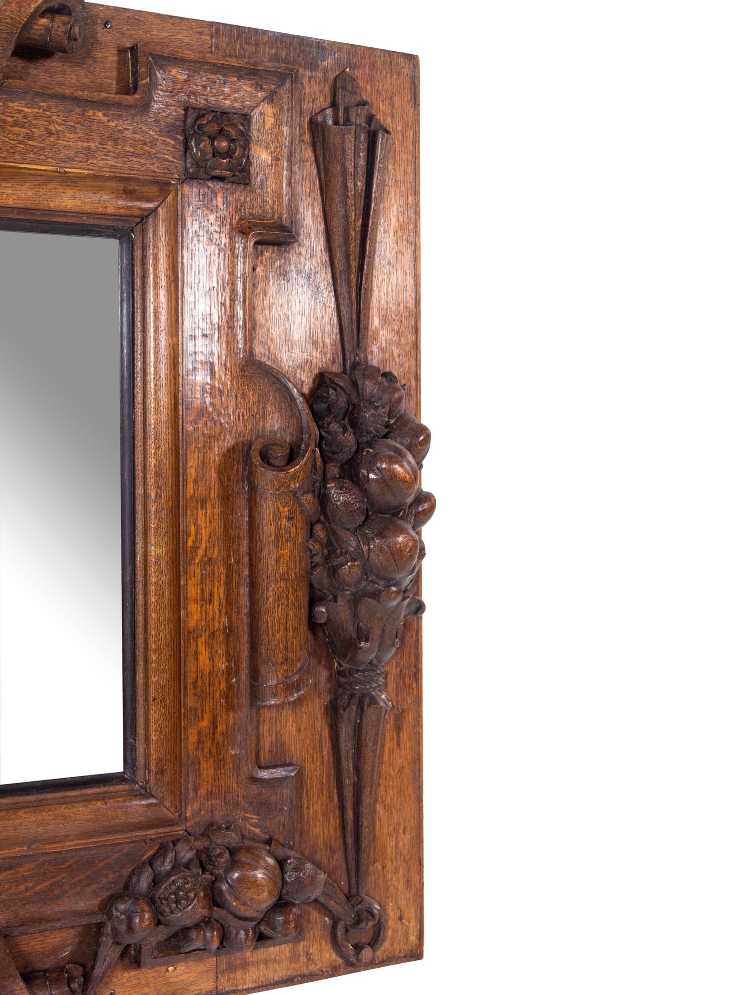 A Continental Carved Oak Mirror