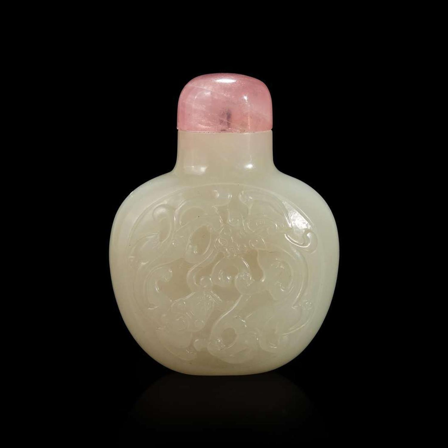 A Chinese carved white jade snuff bottle