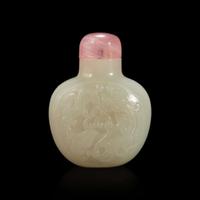 A Chinese carved white jade snuff bottle