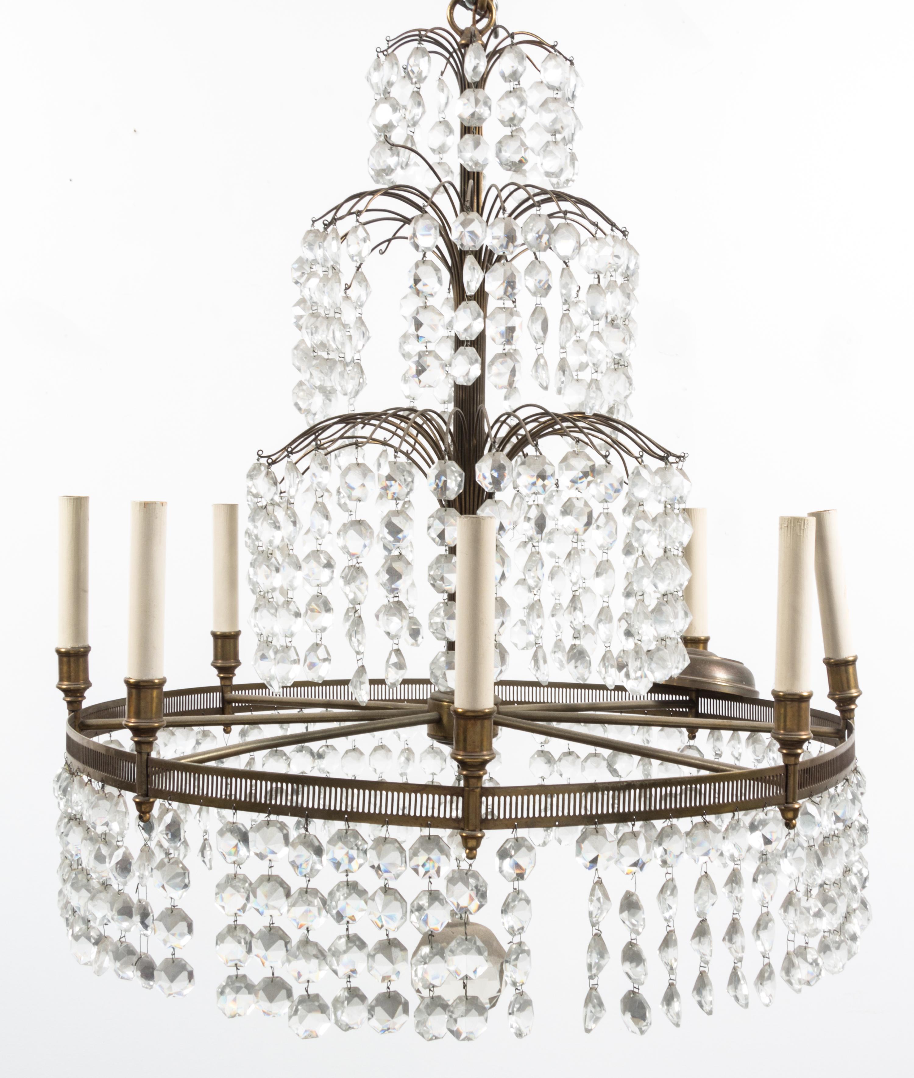 A Baltic Style Gilt Metal Eight-Light Chandelier Height 30 x diameter 24 inches.