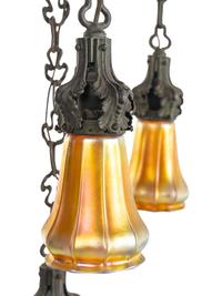 An Art Nouveau Patinated Bronze and Steuben Aurene Glass Seven-Light Ceiling Fixture