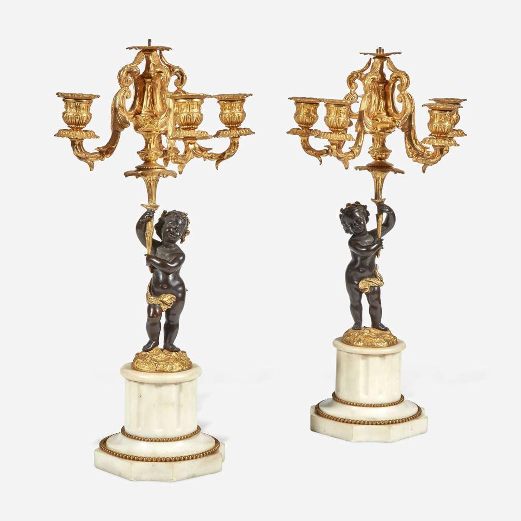 A Pair of Louis XVI Style Gilt and Patinated Bronze Candelabra Late 19th century