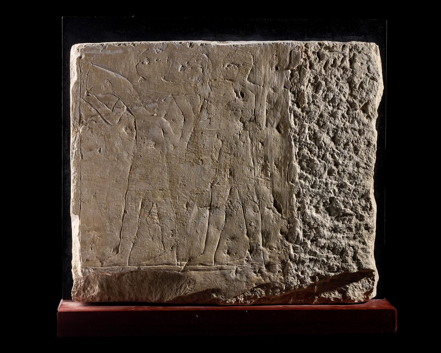 An Egyptian Limestone Relief Fragment Depicting an Offering Scene