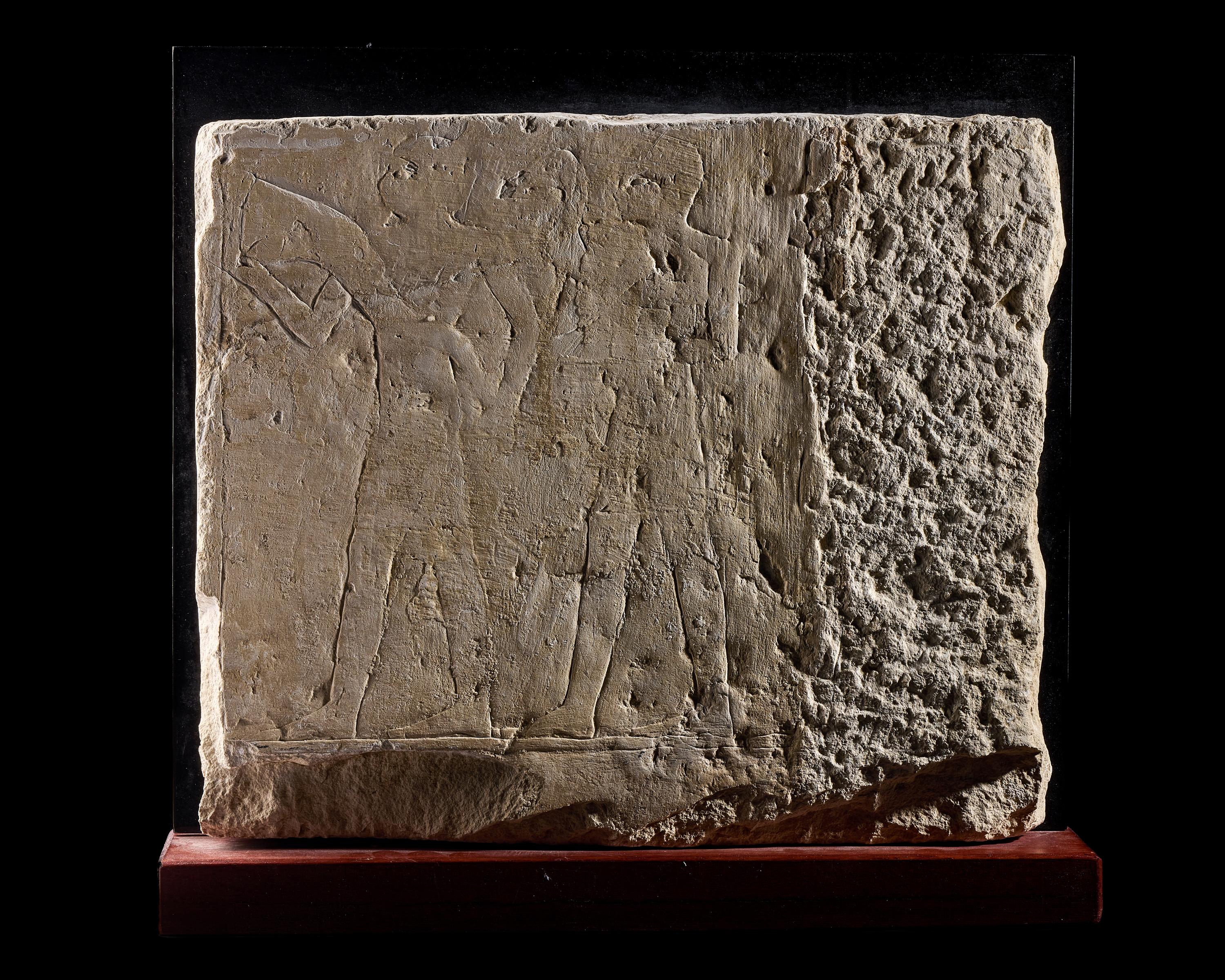An Egyptian Limestone Relief Fragment Depicting an Offering Scene