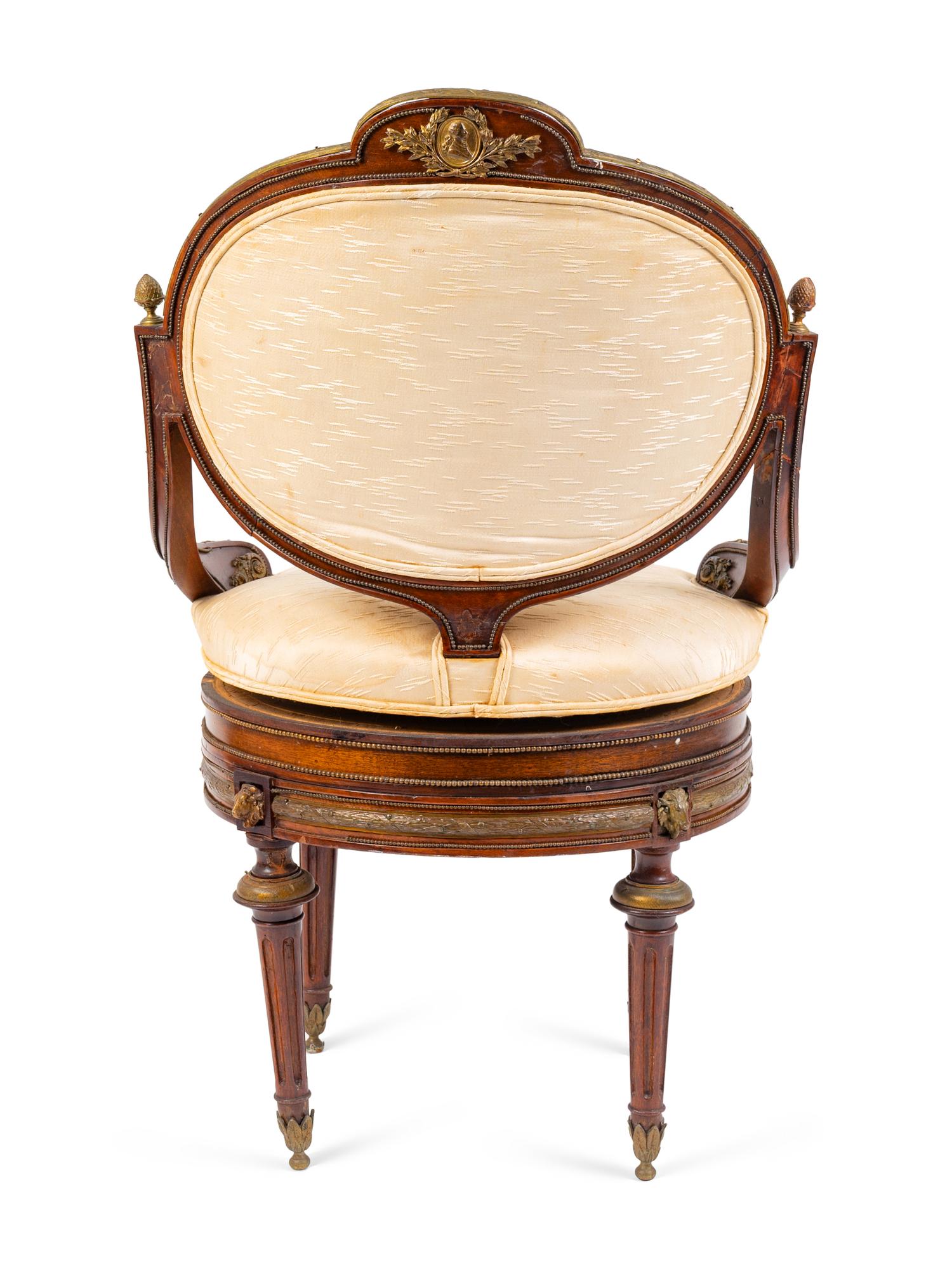A Regency Style Gilt Metal Mounted Mahogany Swivel Chair — 19TH CENTURY