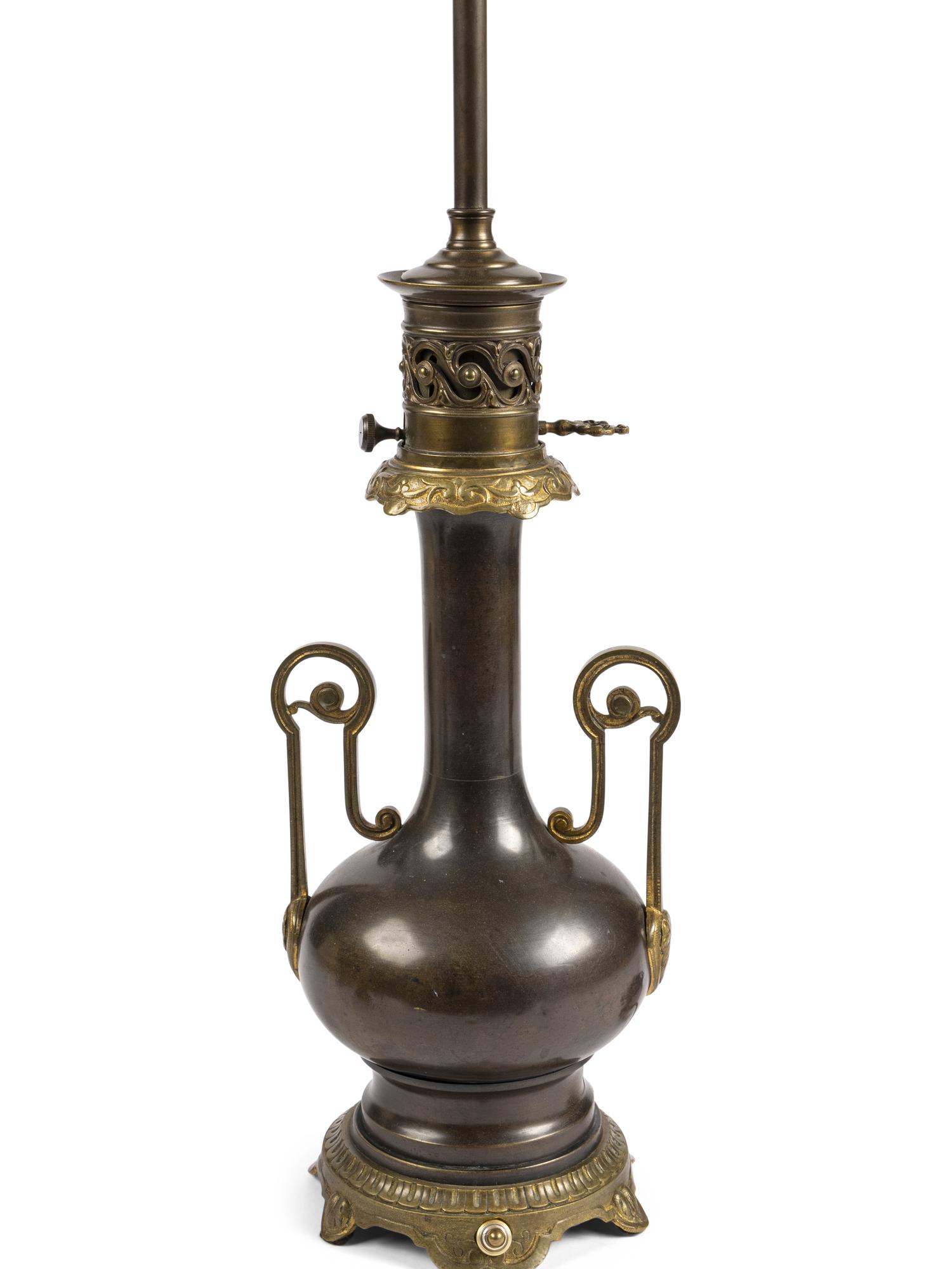 A Pair of French Gilt and Patinated Cast Metal Table Lamps