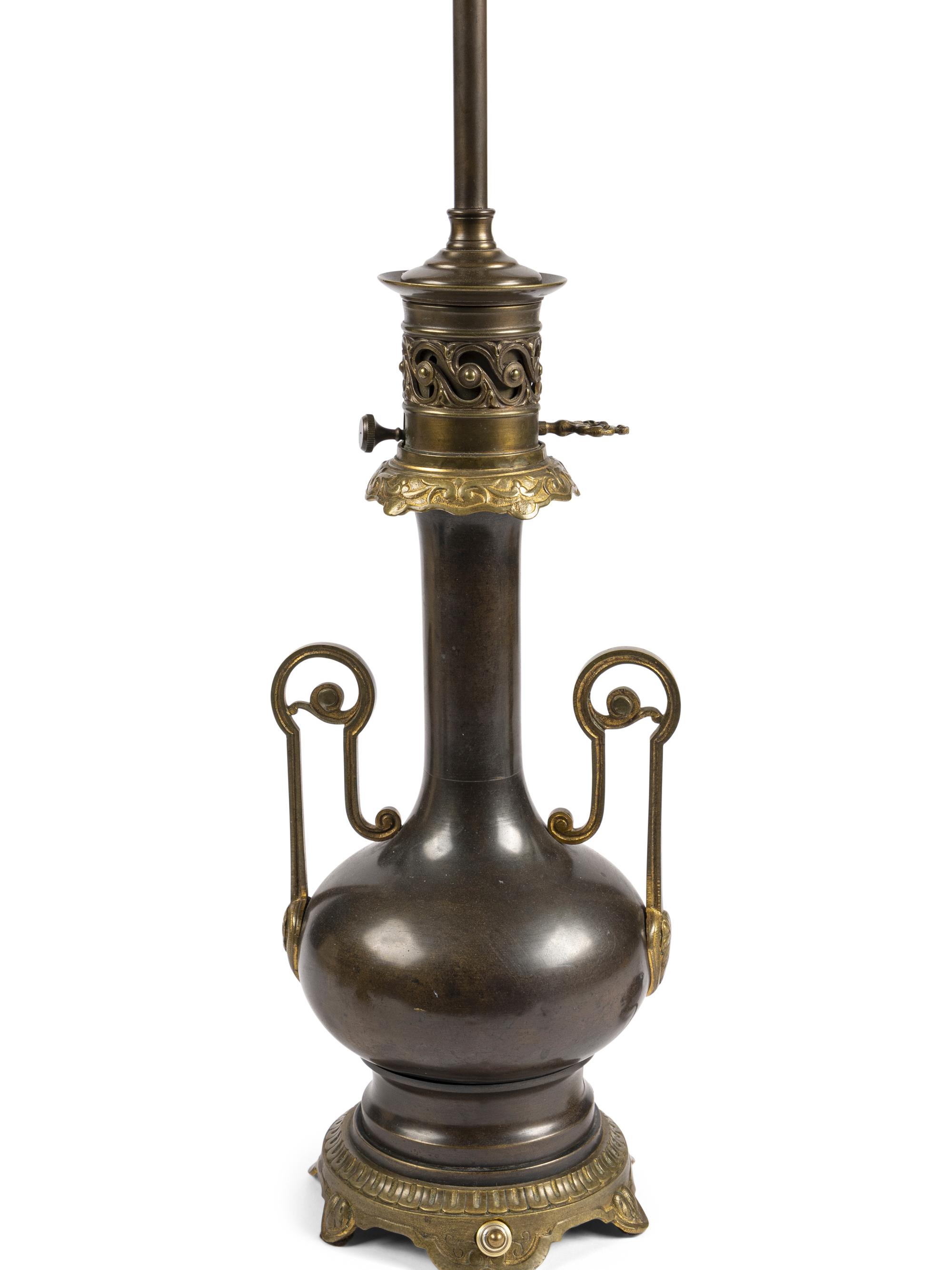 A Pair of French Gilt and Patinated Cast Metal Table Lamps