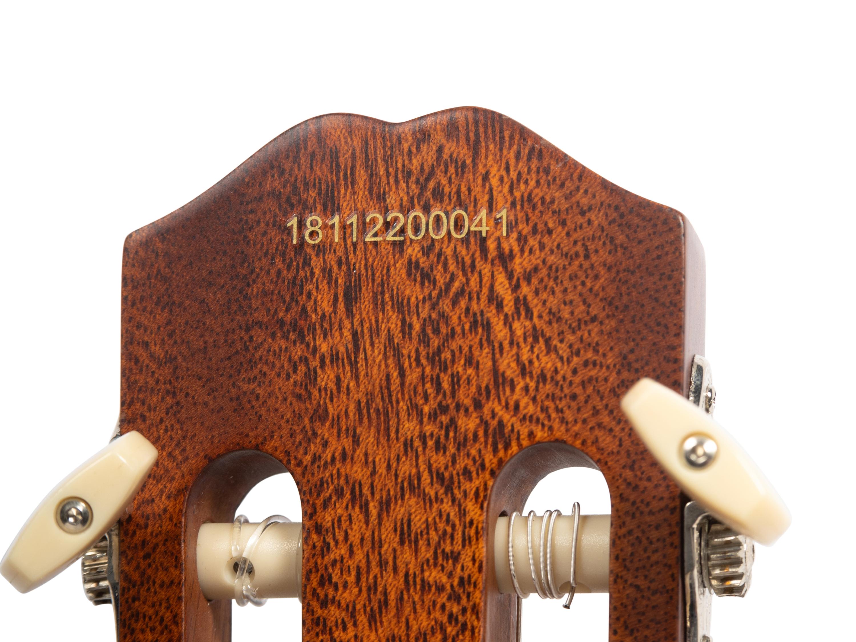 An Epiphone Shadow Cut-Away Acoustic Electric Guitar