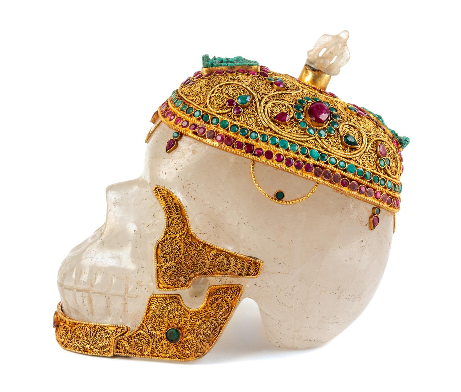 A Mughal Style Gilt Metal and Stone Inset Rock Crystal Skull Height 8 1/2 inches. — 20TH CENTURY