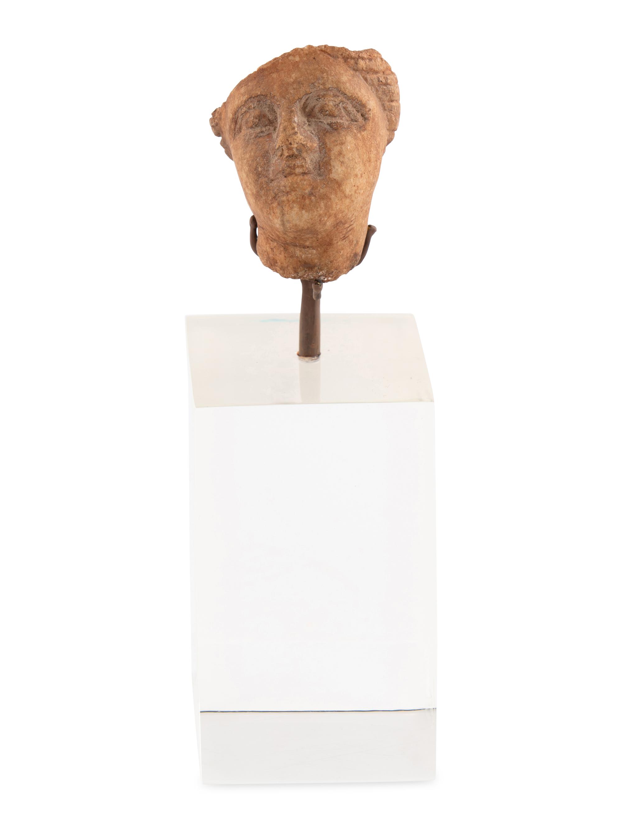 A Roman Stone Head of a Woman