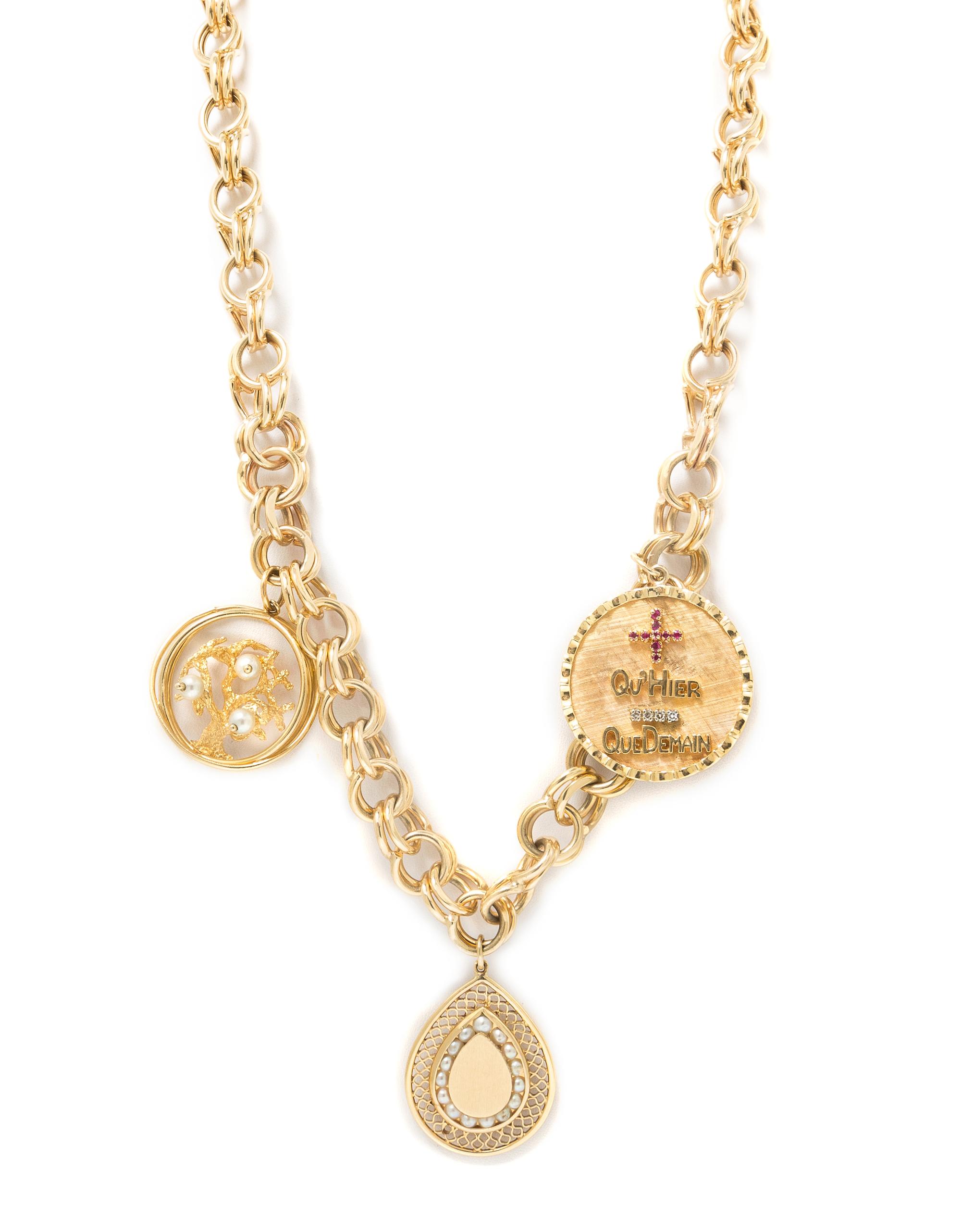 A 14 Karat Yellow Gold Charm Necklace with Three Attached Charms, 66.40 dwts