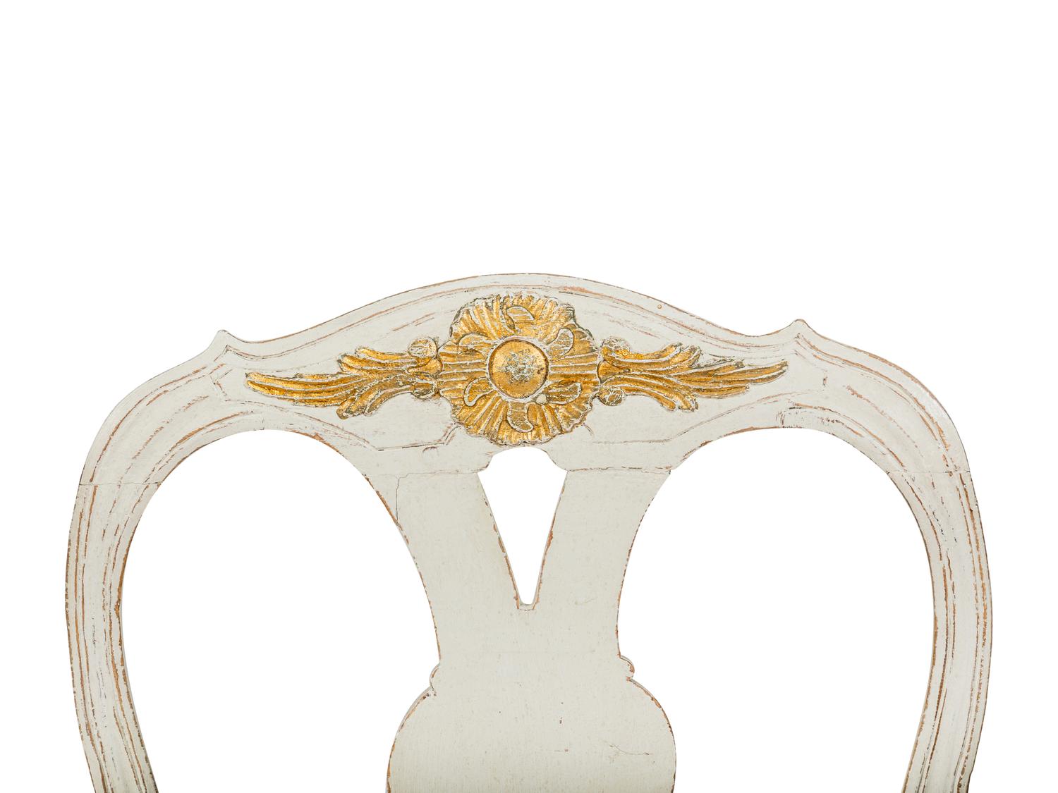 A Pair of Swedish White-Painted and Parcel-Gilt Open Armchairs