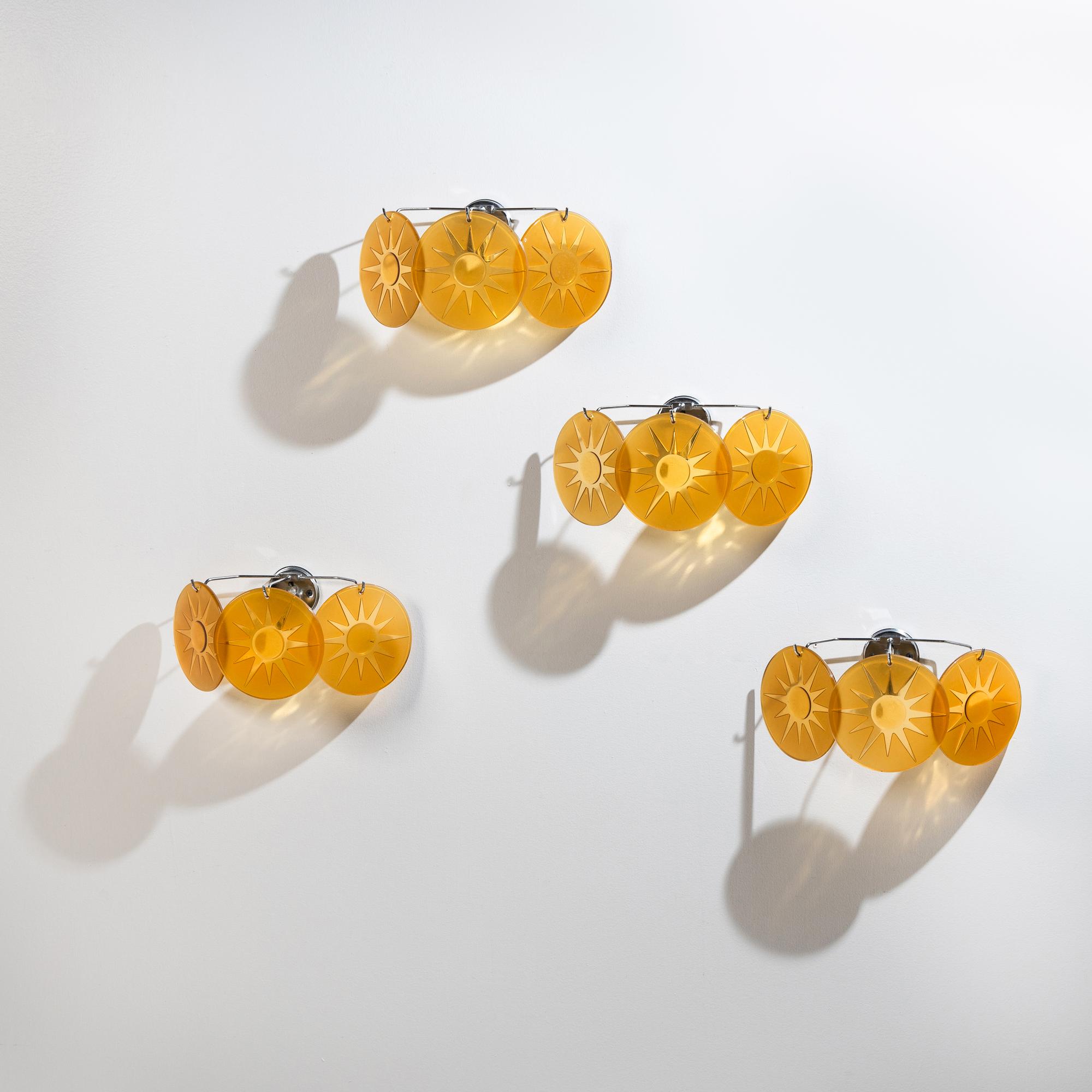Group of Four Amber Glass Three-Light Wall Sconces