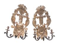 A Pair of Baroque Style Silvered Metal Three-Light Sconces