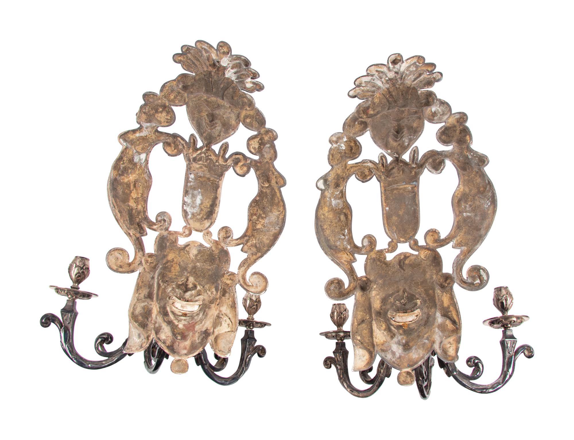 A Pair of Baroque Style Silvered Metal Three-Light Sconces