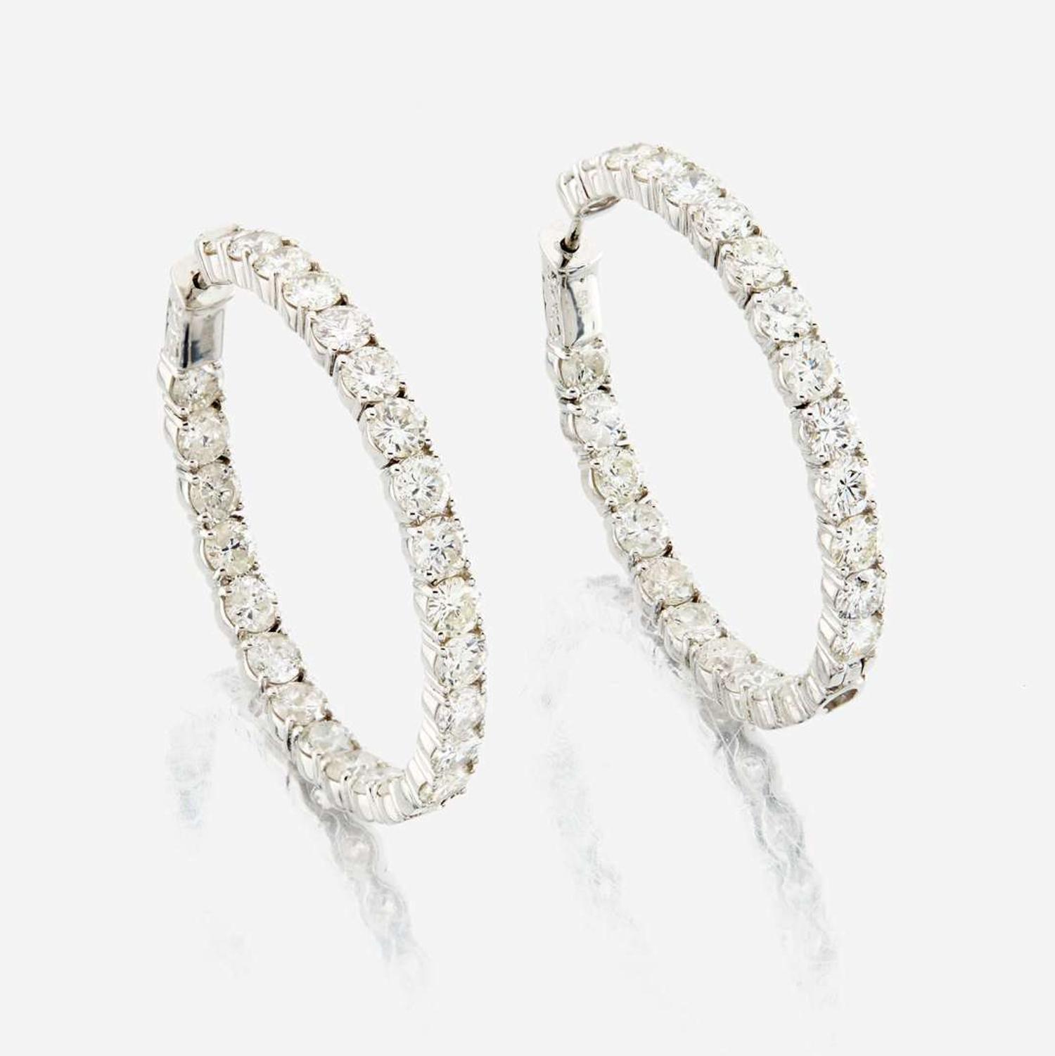 A pair of diamond and white gold earrings