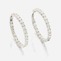 A pair of diamond and white gold earrings