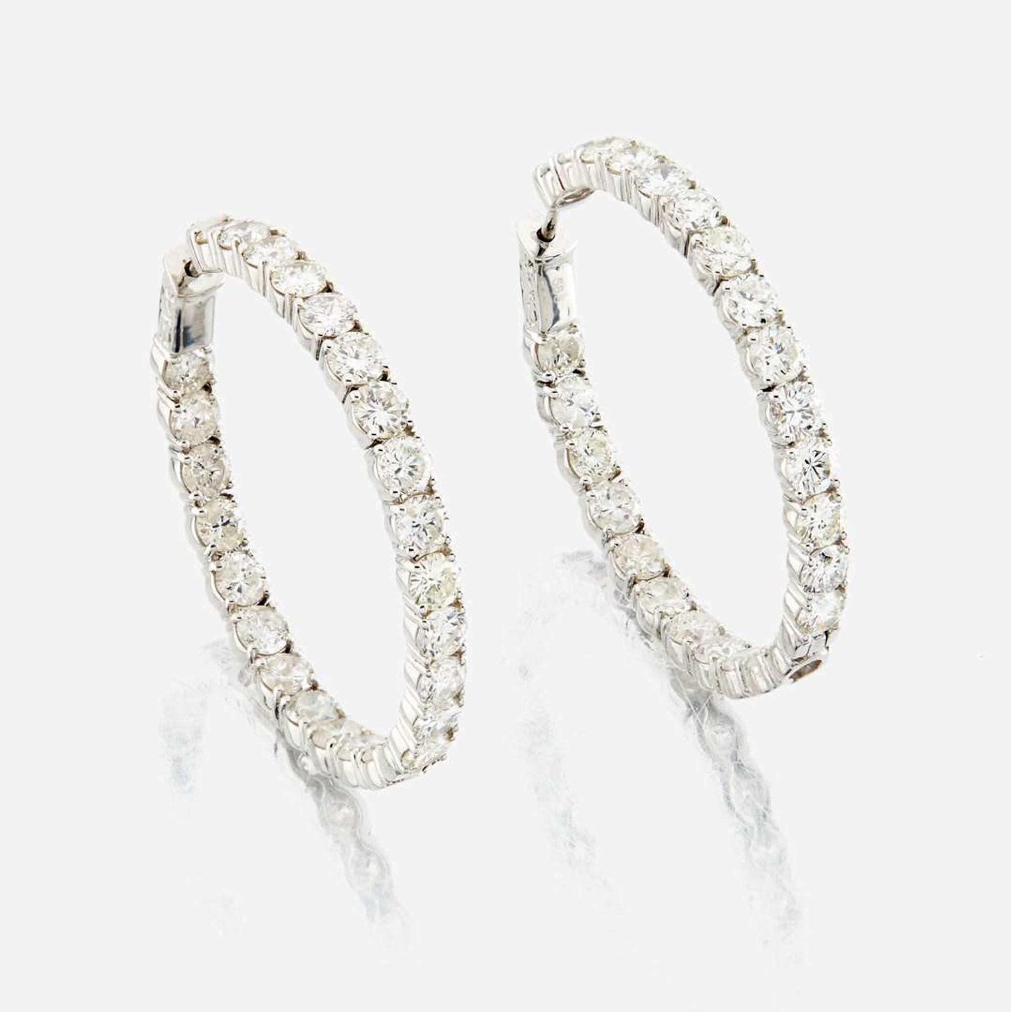 A pair of diamond and white gold earrings