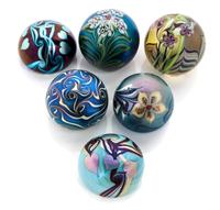 Orient & Flume, CHICO, CA, a group of six iridescent glass paperweights, 1974-1981