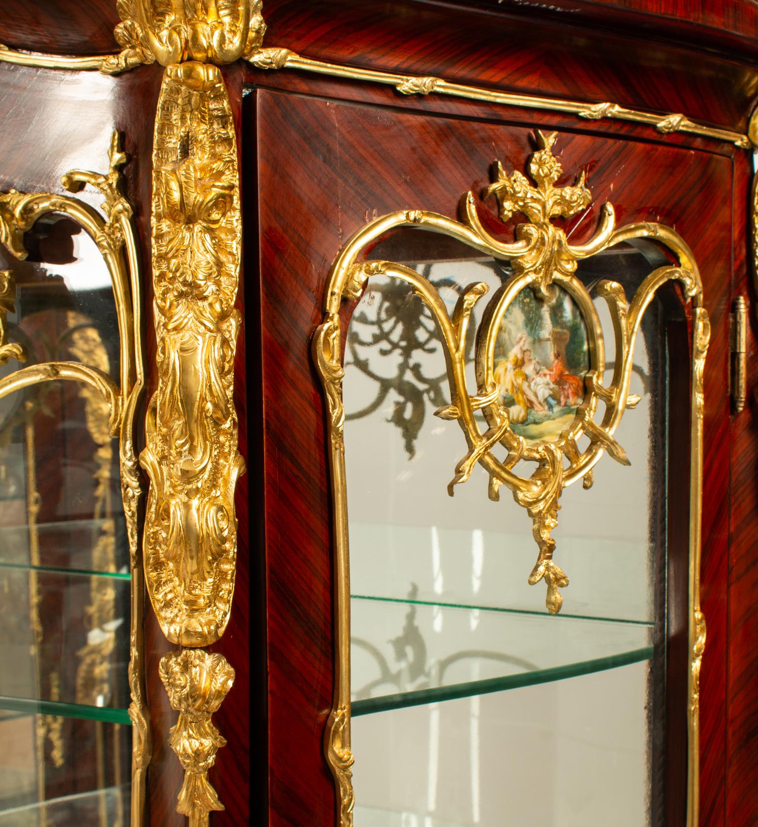 A Pair of Louis XV Style Gilt Bronze Mounted Vitrine Cabinets
