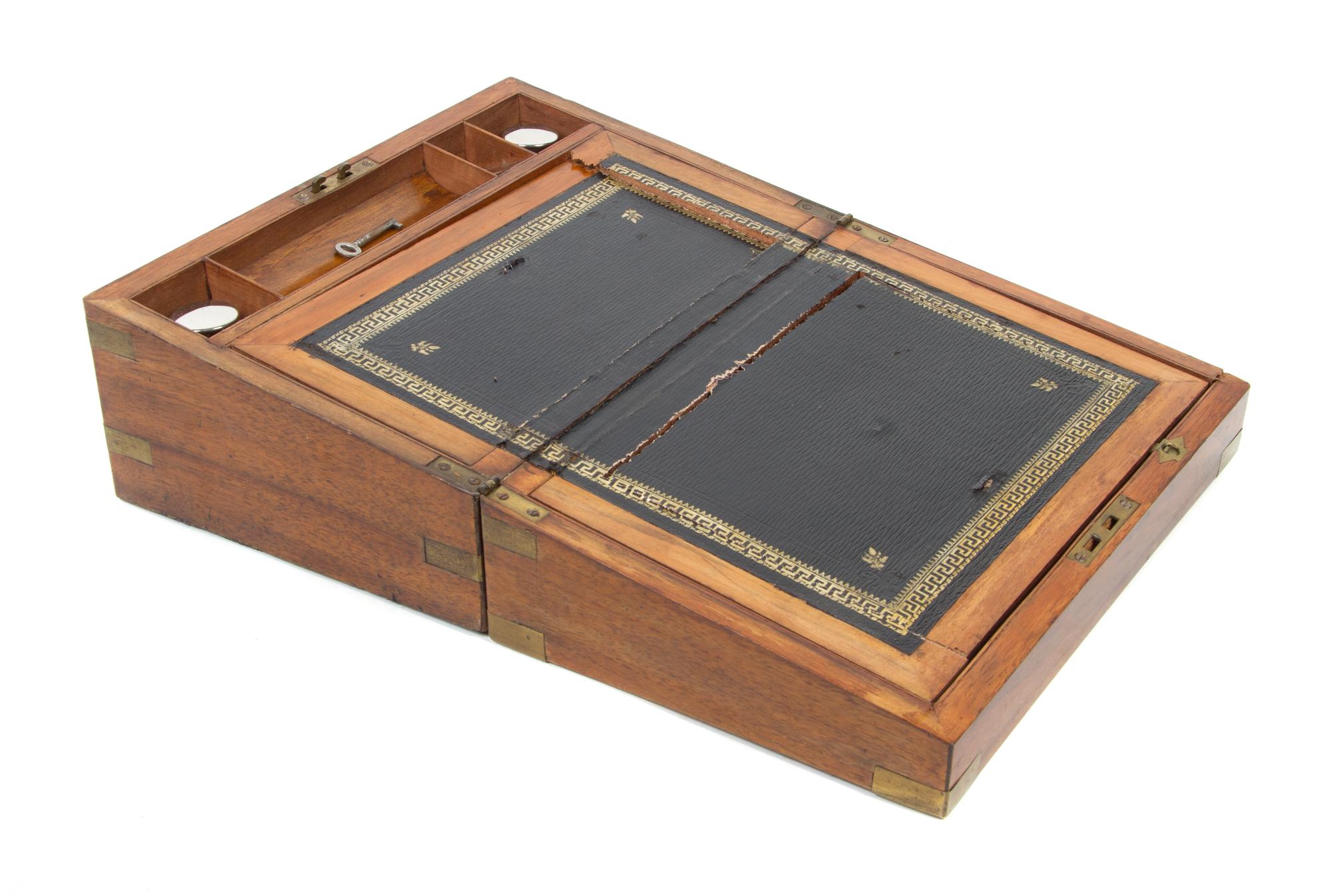 A Regency Brass Banded Mahogany Writing Box Height 6 1/2 x width 13 3/4 x depth 9 1/4 inches.