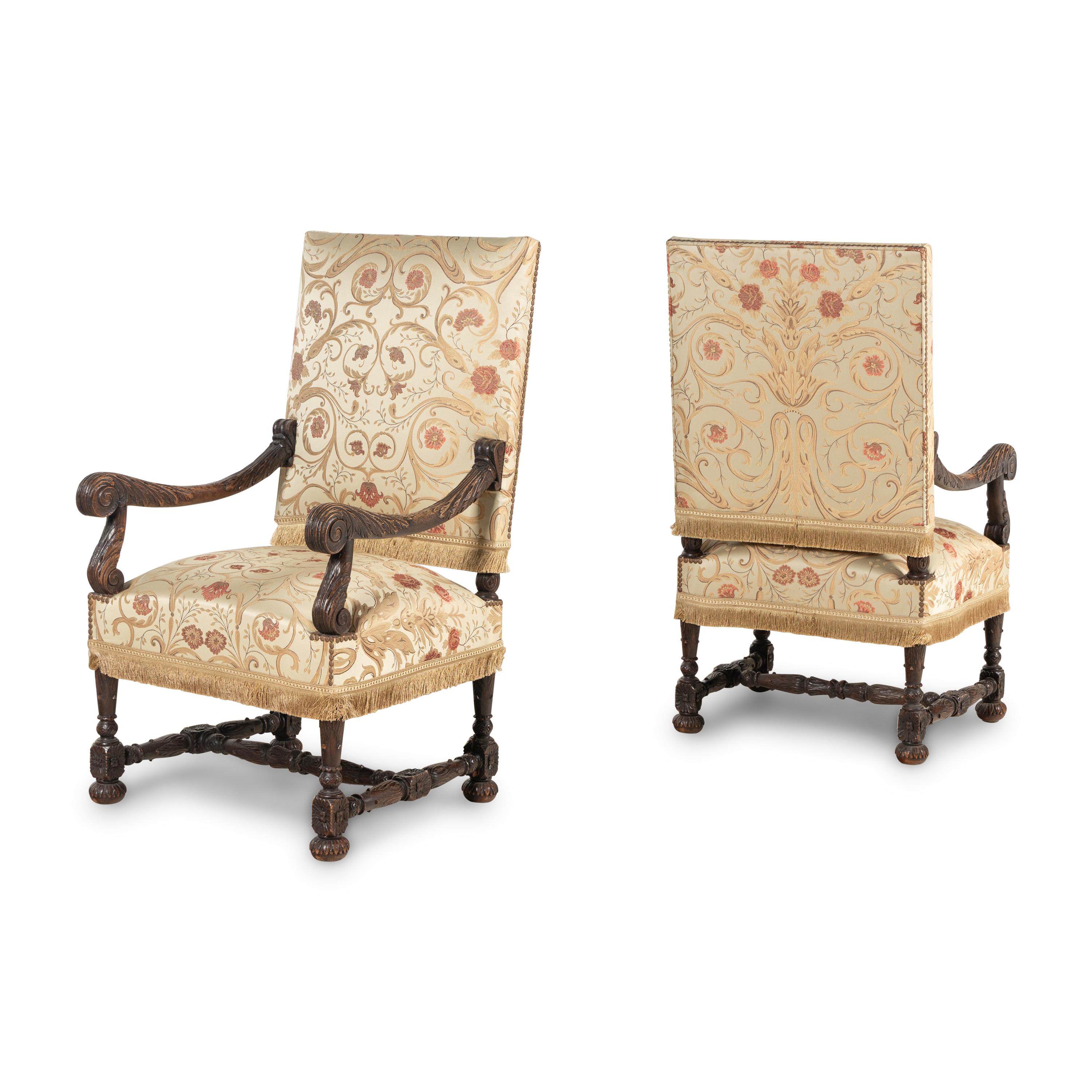 A Pair of Louis XIII Style Carved Oak Fauteuils