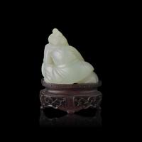 A Chinese White Jade Carved Boy, Qing Dynasty 清 白玉雕弄鼓童子
