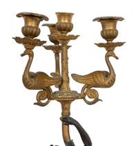 A Pair of French Empire Style Gilt and Patinated Bronze Figural Four-Light Candelabra