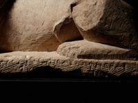 An Egyptian Limestone Recumbent Lion