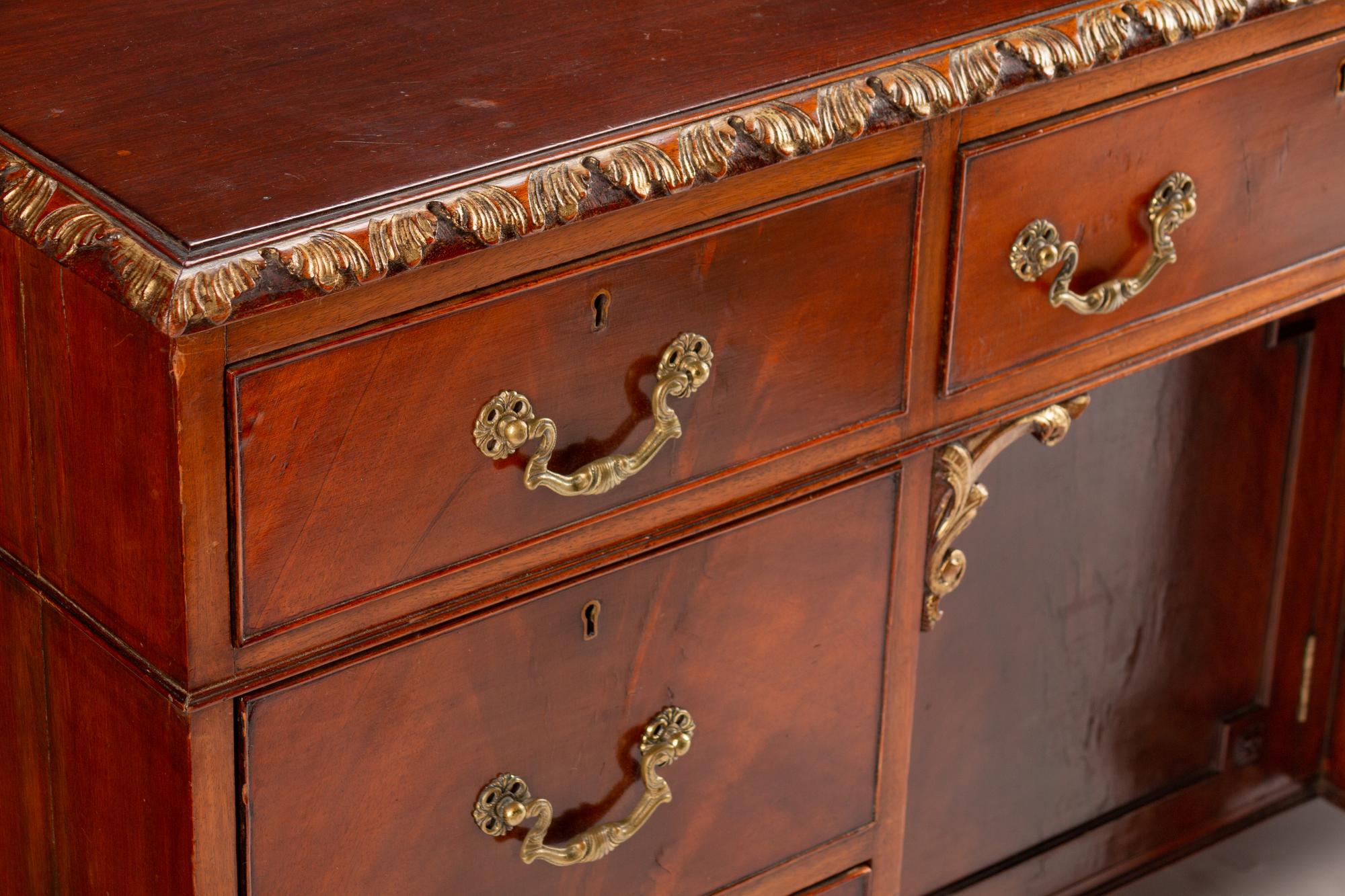 A George III Style Parcel-Gilt Mahogany Kneehole Desk — LATE 19TH/EARLY 20TH CENTURY