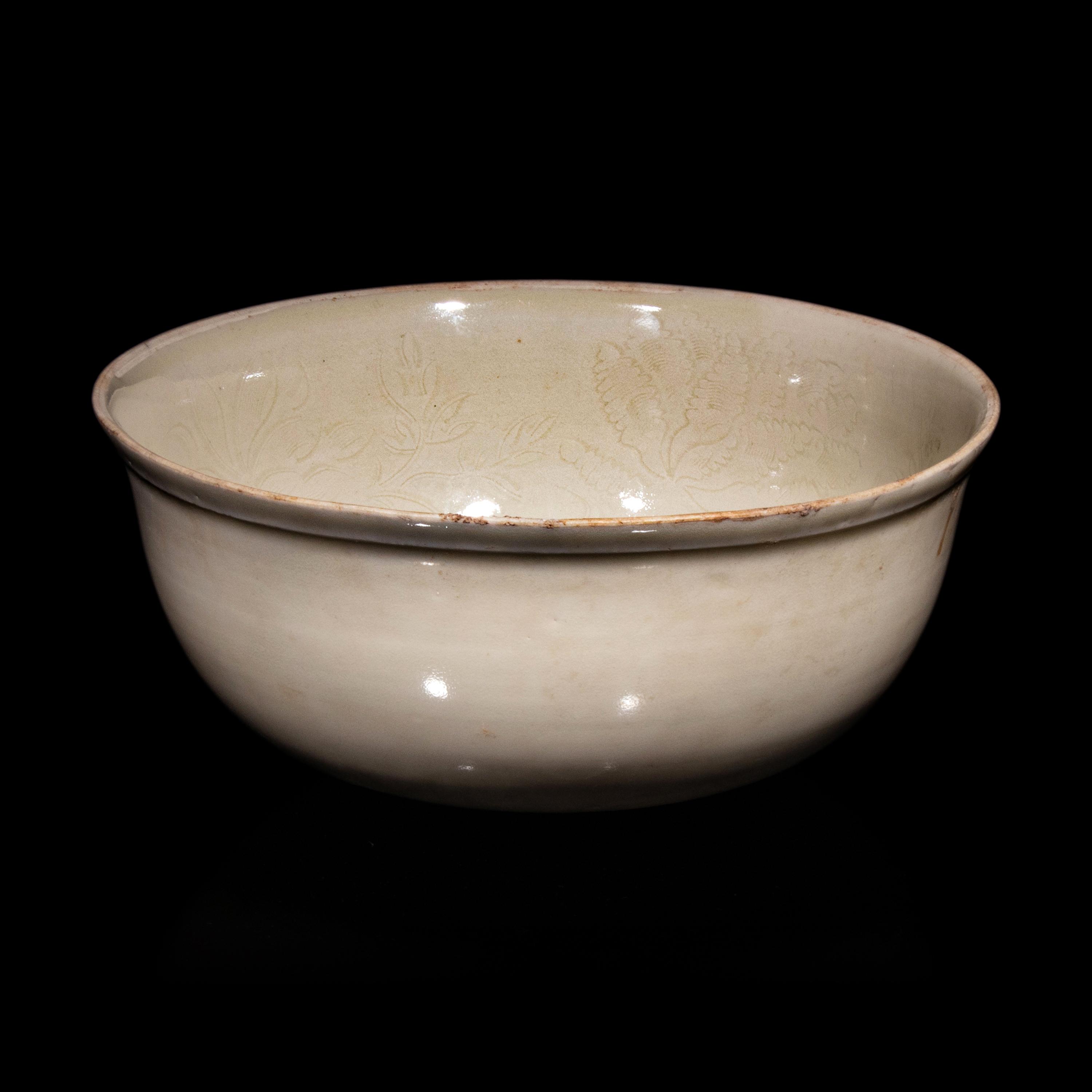 A Chinese Ding -Style Incised White Glazed Porcelain Bowl, Possibly Song Dynasty 或為宋 定窯白釉劃花鳳穿牡丹紋碗