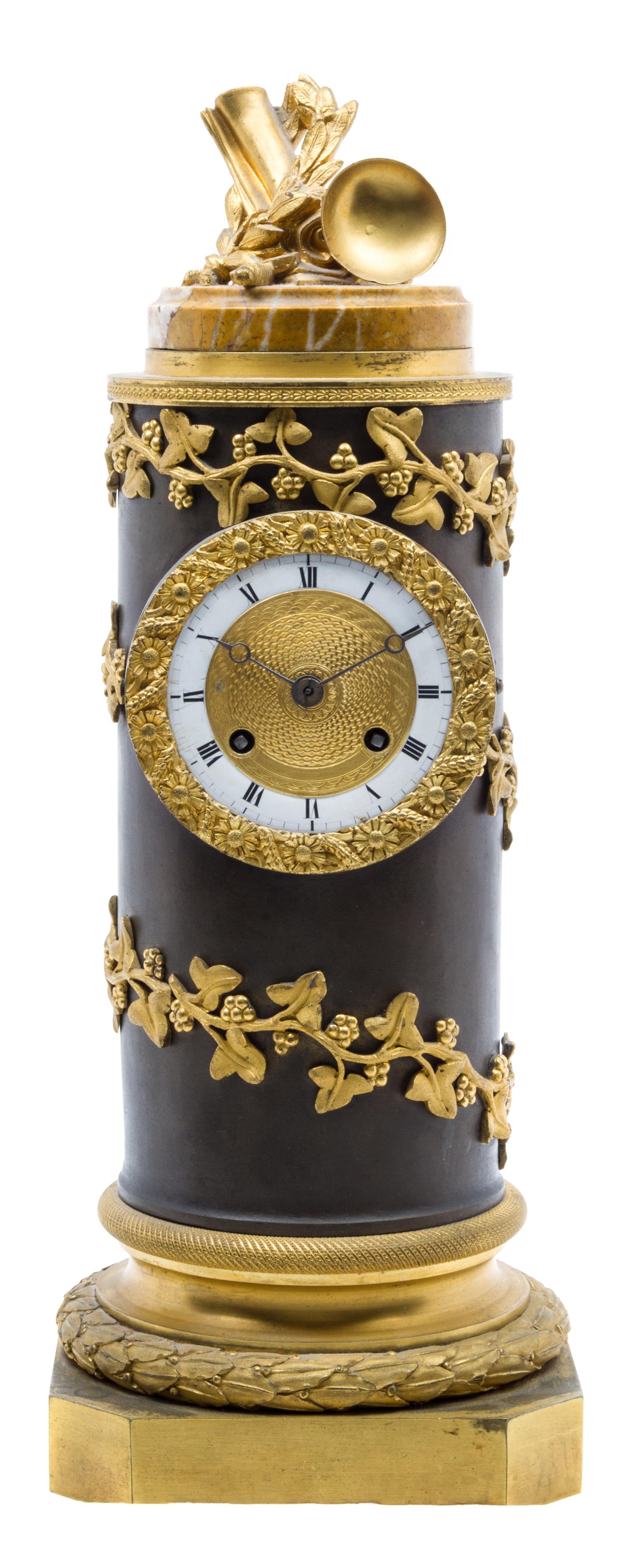 An Empire Gilt and Patinated Bronze Clock Height 16 inches.