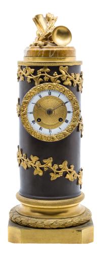 An Empire Gilt and Patinated Bronze Clock Height 16 inches.