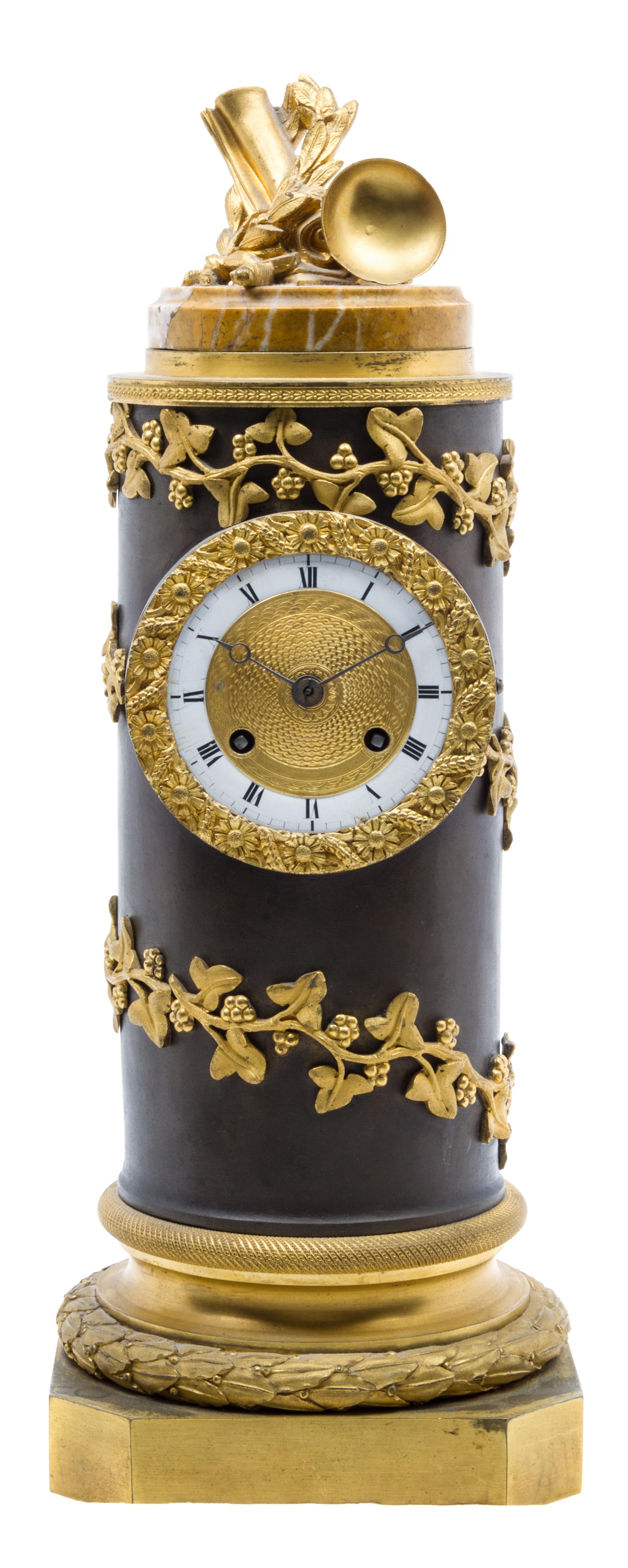 An Empire Gilt and Patinated Bronze Clock Height 16 inches.